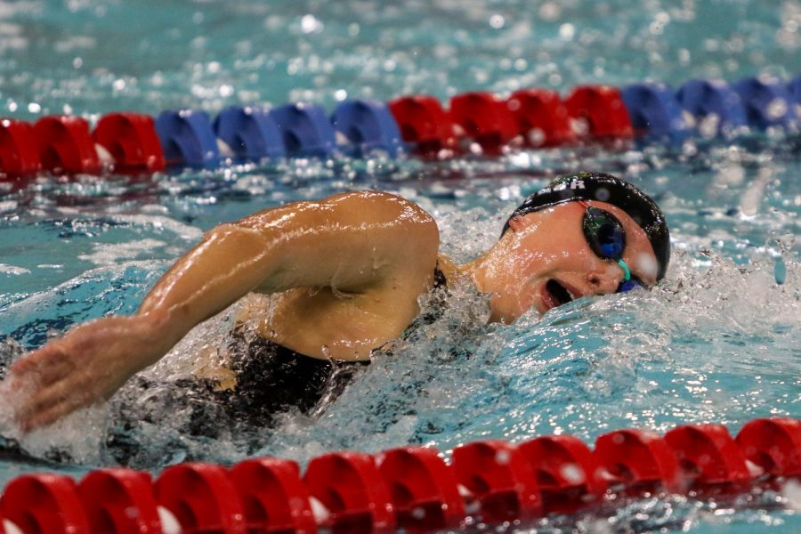 Olivia Taeger '22 swims the 100 yard freestyle during the IGHSAU State Swimming and Diving Championships in Marshalltown on Nov. 13.