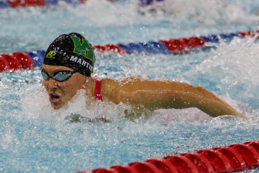 Scarlet Martin '22 swims the 100 yard butterfly during the IGHSAU State Swimming and Diving Championships in Marshalltown on Nov. 13.