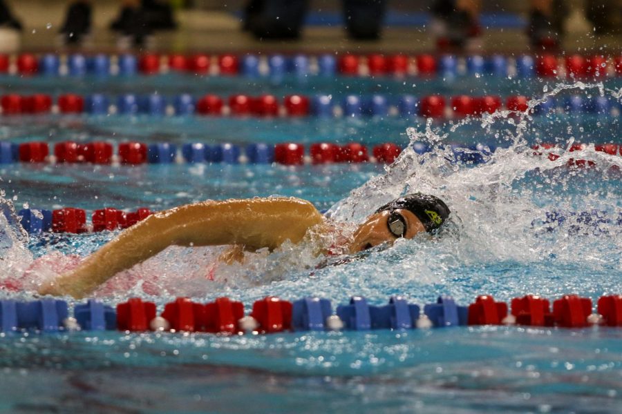 Scarlet Martin '22 swims the last leg of the 400 yard freestyle relay during the IGHSAU State Swimming and Diving Championships in Marshalltown on Nov. 13.