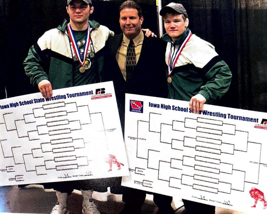 Coach Mark Reiland with Nelson Brands 18 and Francis Duggan 18 at the 2018 Wrestling State Championship. Both Brands and Duggan won titles.