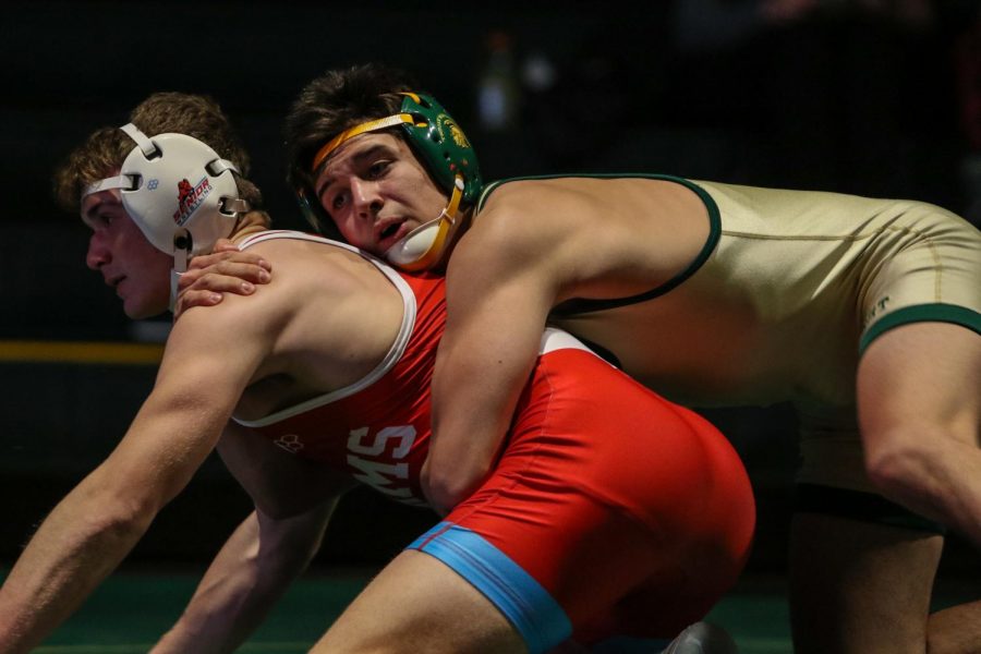 Hunter Garvin '22 gains control of his opponent during a dual meet against Dubuque Senior on Dec. 9.