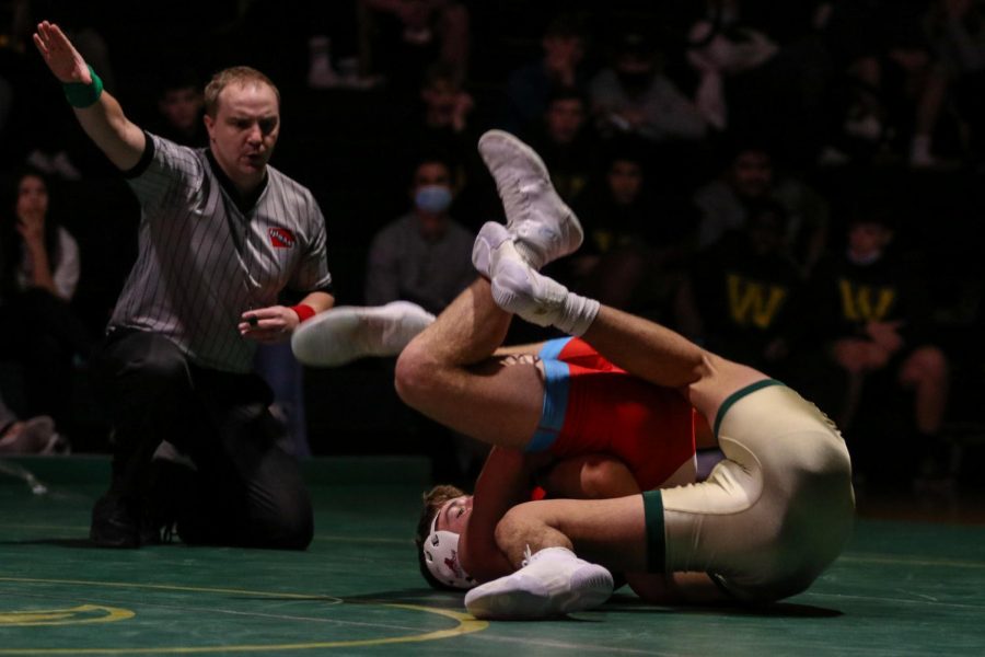 Hunter Garvin 22 looks for a pin during a dual meet against Dubuque Senior on Dec. 9.