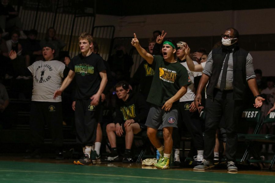 Robert Avila 22 questions the call by the official during a dual meet against Dubuque Senior on Dec. 9.