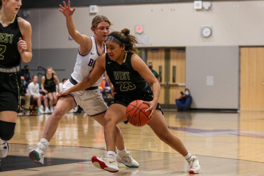 Keiko Ono-Fullard ’23 drives into the line against cross-town rival Liberty on Dec. 10.