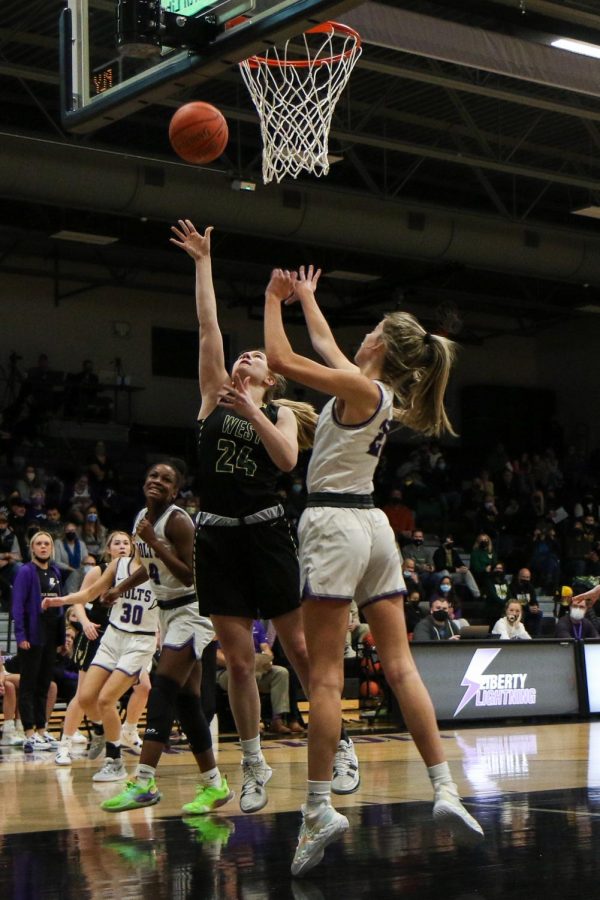 Anna Prouty 23 goes up for a layup against cross-town rival Liberty on Dec. 10.