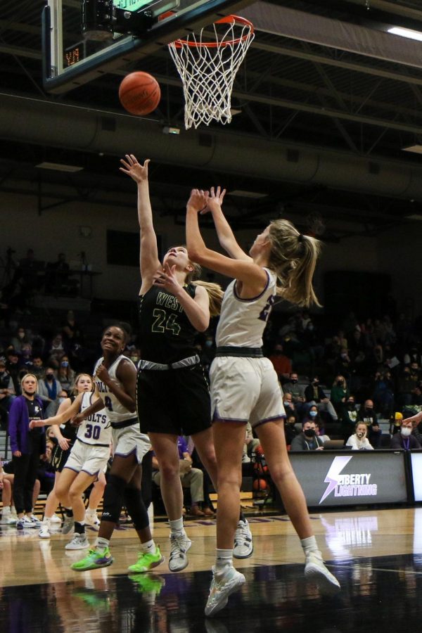 Anna Prouty '23 goes up for a layup against cross-town rival Liberty on Dec. 10.