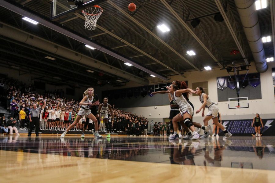 Lucy Wolf '24 shoots a free throw in the final seconds of the game against cross-town rival Liberty on Dec. 10.