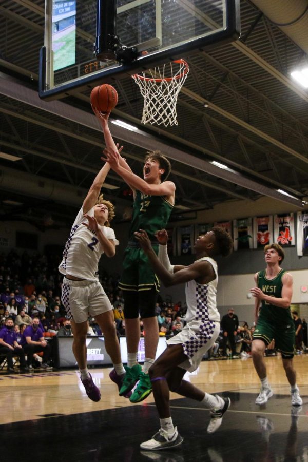 Jack McCaffery 25 goes up for a layup against cross-town rival Liberty on Dec. 10.
