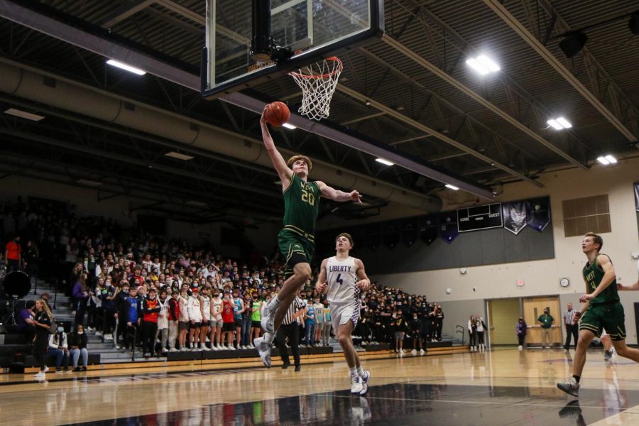 Pete Moe 22 goes up for a dunk in the second half against cross-town rival Liberty on Dec. 10.
