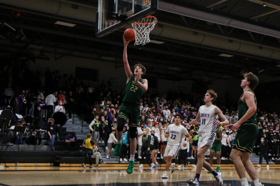 Jack McCaffery 25 goes up for a layup against cross-town rival Liberty on Dec. 10.