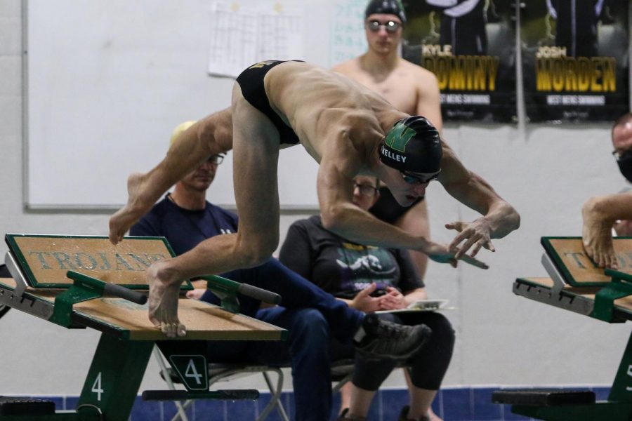 Boyd Skelley 22 flys off of the blocks at the start of the 100 yard breaststroke during a dual meet against Waterloo on Dec. 14. 