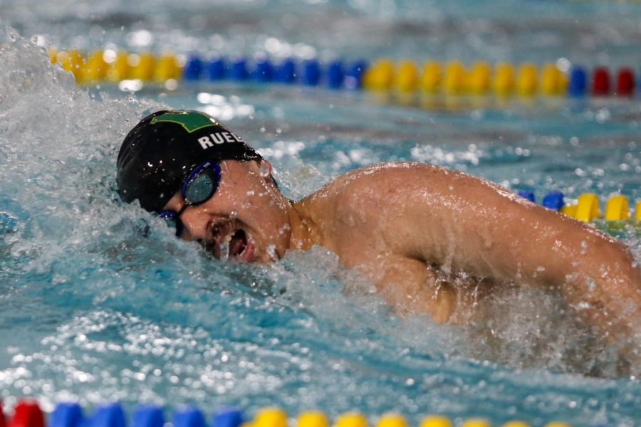 Sam Ruelas 24 swims the 200 yard freestyle during a dual meet against Waterloo on Dec. 14.