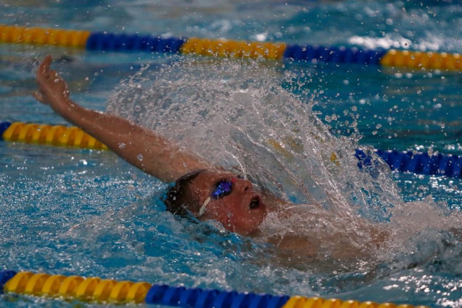 Max Gerke 24 swims the 200 yard individual medley during a dual meet against Waterloo on Dec. 14.