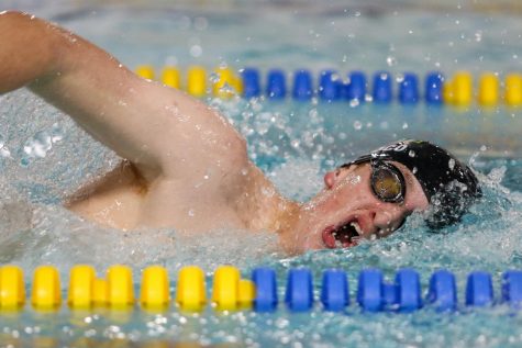 Dillon Croco 24 swims in the 400 yard freestyle relay during a dual meet against Waterloo on Dec. 14.