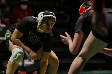 Jannell Avila '23 eyes her opponent at the start of the 160 pound match during a dual meet against City High on Dec. 22.