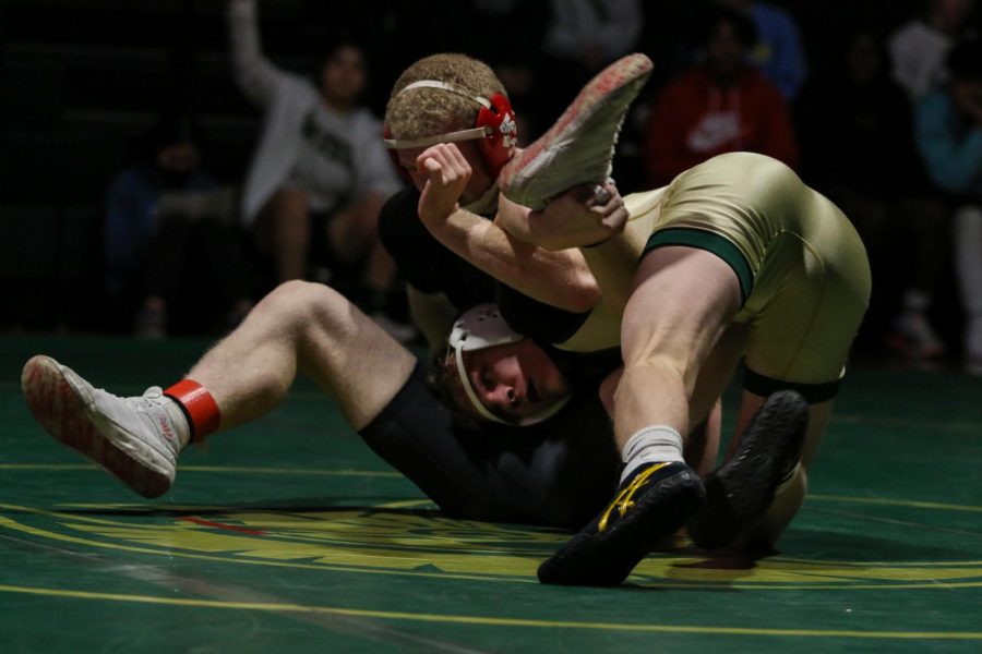 Grant ODell 22 fights for a takedown during a dual meet against City High on Dec. 22.