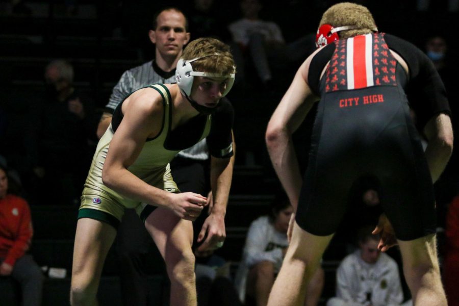 Grant ODell eyes his opponent during a dual meet against City High on Dec. 22. 