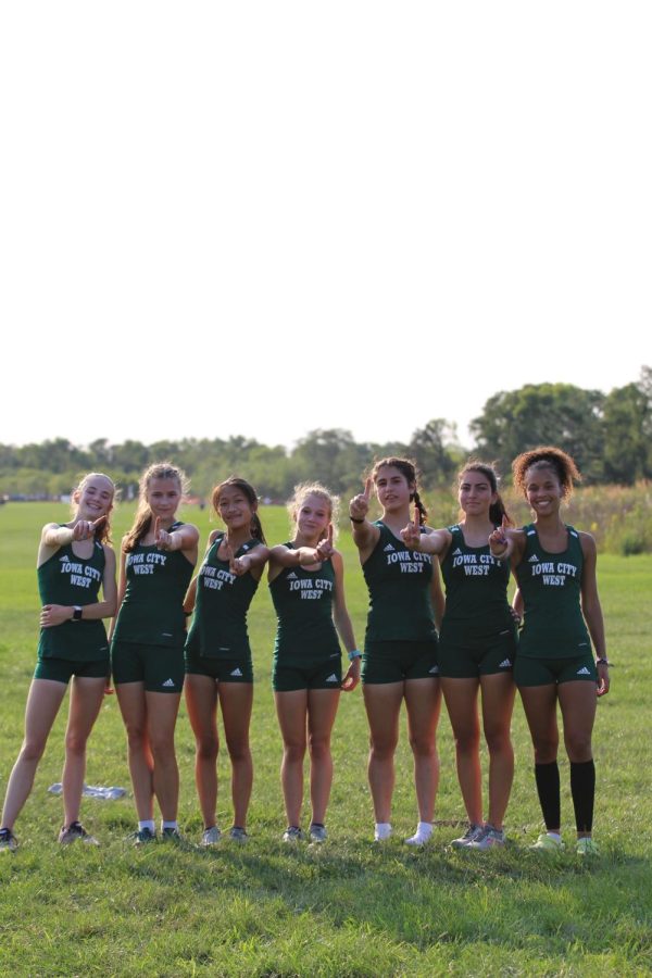 The girls cross country team celebrates after a meet at Seminole Valley cross country course on Sept. 9, 2021.
