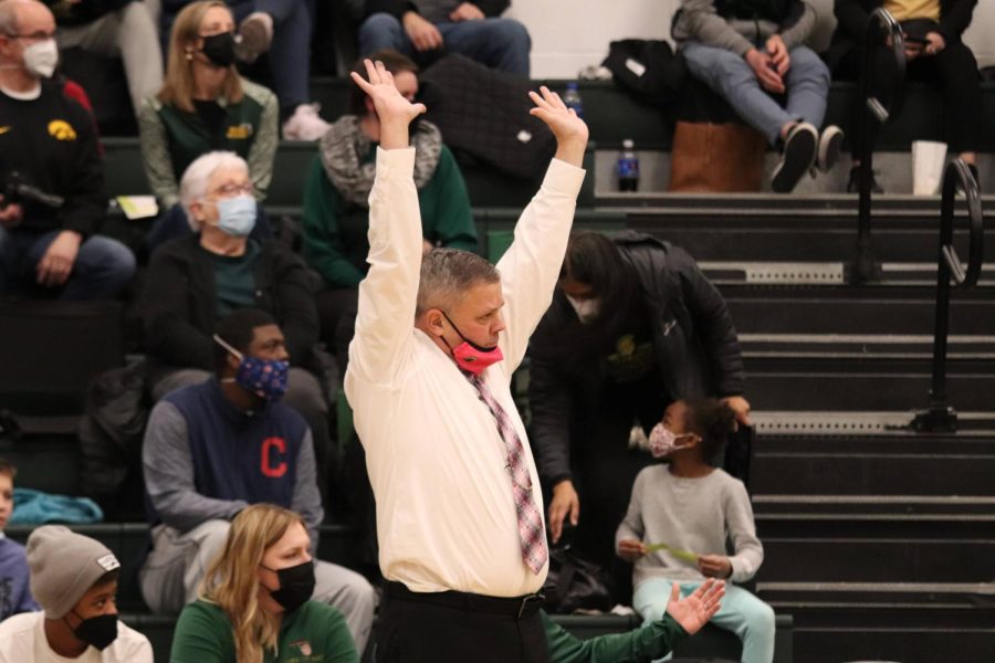 Coach BJ Mayer raises his hands in protest against a bad call. 