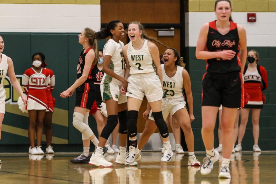 Lucy Wolf 24 celebrates after taking a charge against City High on Jan. 21. 