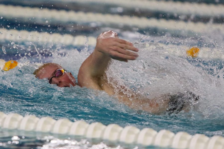 Max Gerke 24 swims his leg of the 400 yard Freestyle Relay during the annual Battle for the Golden Speedo on Jan. 18.