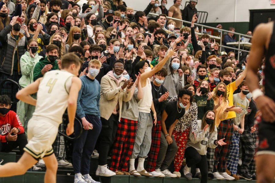 The West High student section reacts to a Jacob Koch 24 three pointer against City High on Jan. 21.