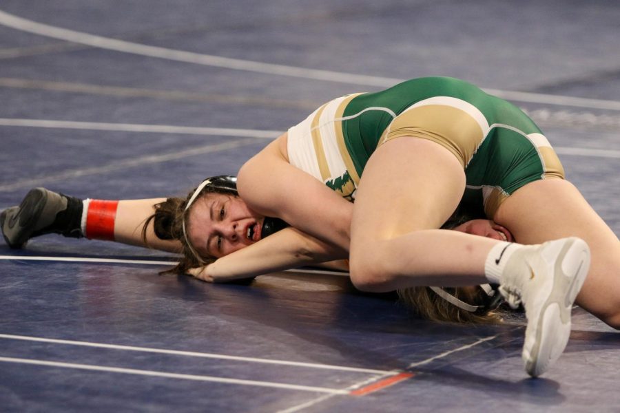 Emma Barker wrestles Charles Citys Morgan Maloy 23 in the consolation bracket at the Xtream Arena in Coralville during the 2022 girls state wrestling tournament on Jan. 22.  
