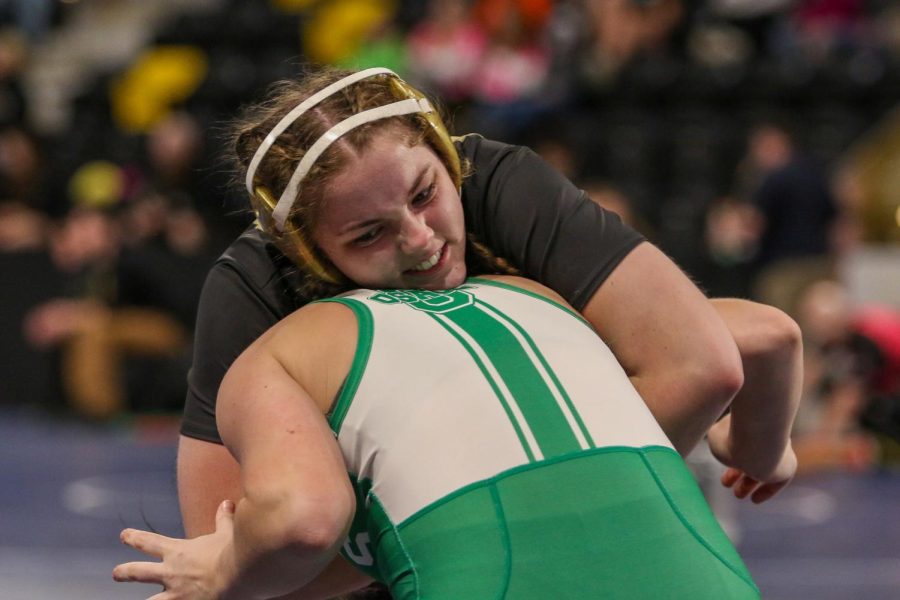 Lexi Nash 23 wrestles Osages 
Leah Grimm 22 in the consolation bracket at the Xtream Arena in Coralville during the 2022 girls state wrestling tournament on Jan. 22.  