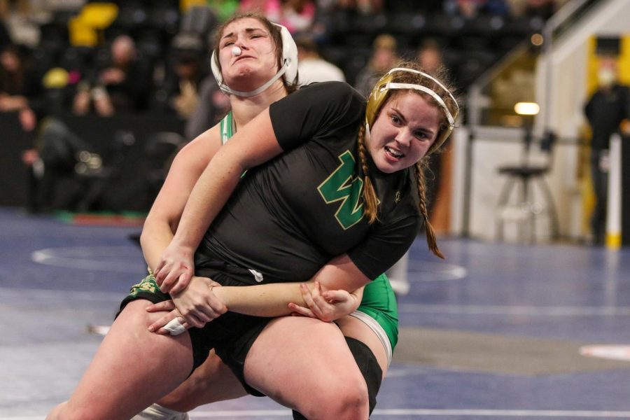 Lexi Nash 23 fights for an escape while wrestling Osages 
Leah Grimm 22 in the consolation bracket at the Xtream Arena in Coralville during the 2022 girls state wrestling tournament on Jan. 22.  