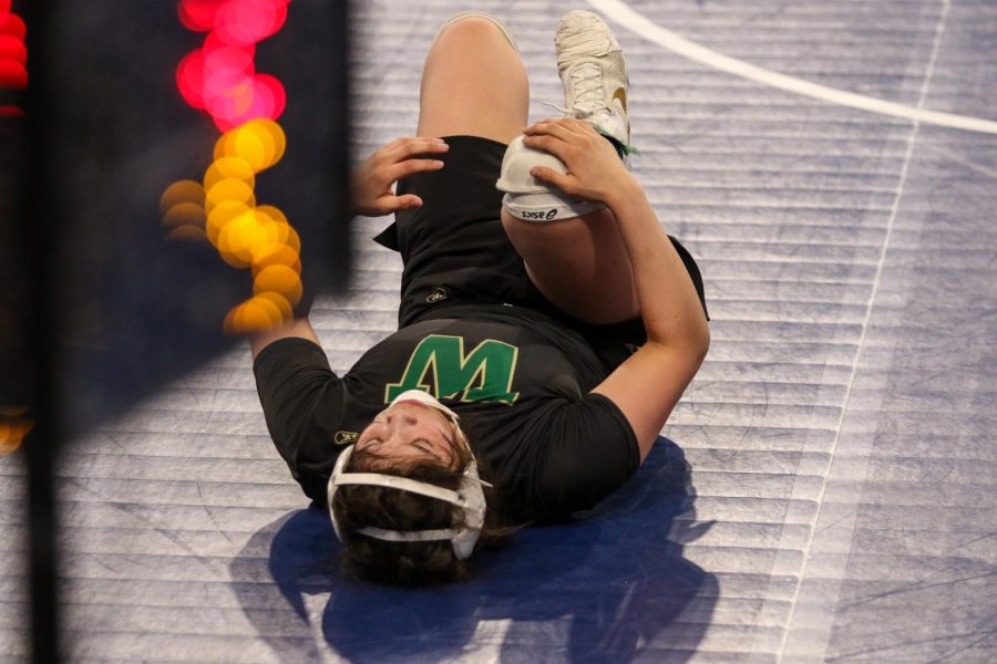 Jannell Avila 23 reacts after losing in the semifinals at the Xtream Arena in Coralville during the 2022 girls state wrestling tournament on Jan. 22.