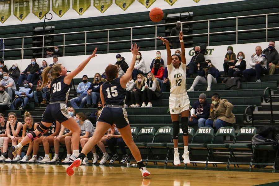Meena Tate 23 attempts a corner three in the first game of the doubleheader against Xavier on Jan. 4.