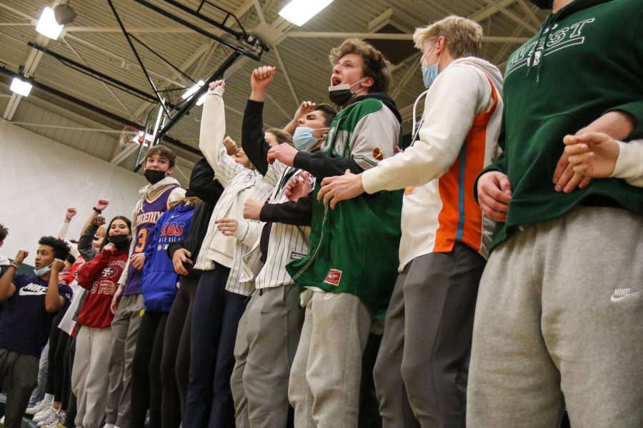 The student section celebrates the Trojans 48-46 win over Xavier in the second game of the doubleheader on Jan. 4.