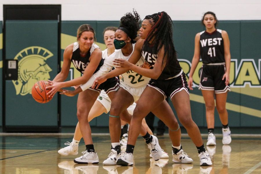 Melae Lacy 24 fights for a steal against Waterloo West on Jan. 7.