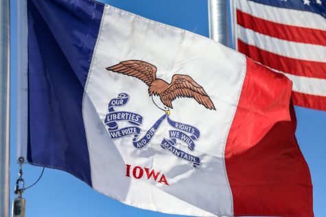 The flag of the state of Iowa flies outside of the University Heights Police station.