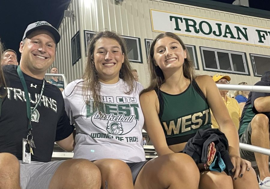Zola, Mary Danielle, and Mitch Gross spending some family time at a Iowa City West football game.