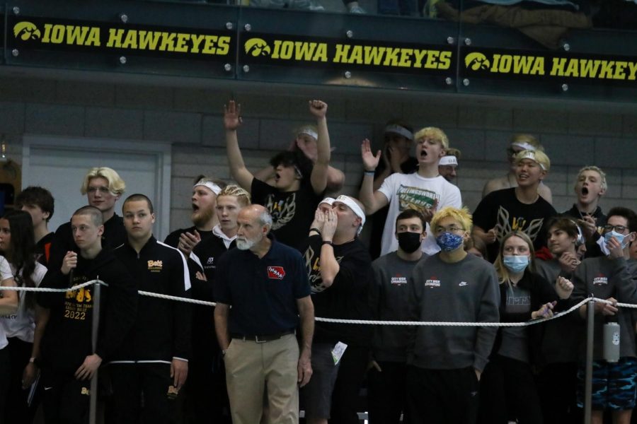 The West-Liberty boys swim team cheers on their 400 freestyle relay team on Feb. 12.