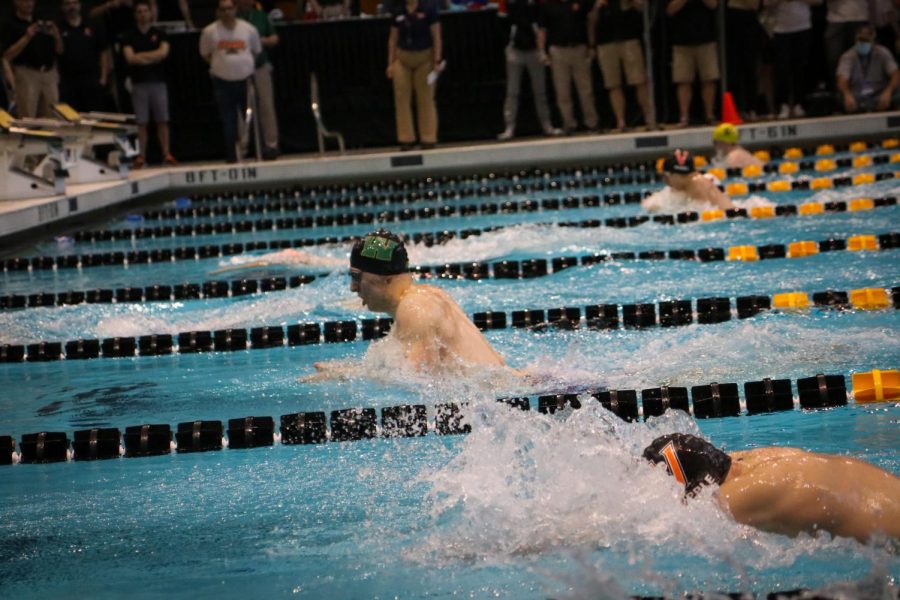 Jordan Christensen 22 swims ahead during the 100 breaststroke final on Feb. 12.