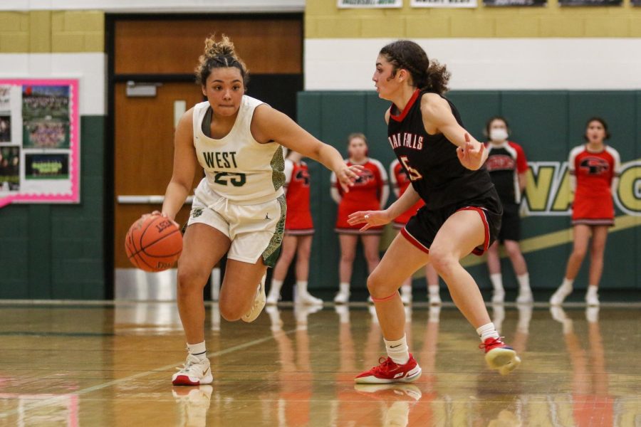 Keiko Ono-Fullard 23 pushes the ball up the floor against Cedar Falls in the regional semifinal on Feb. 19.