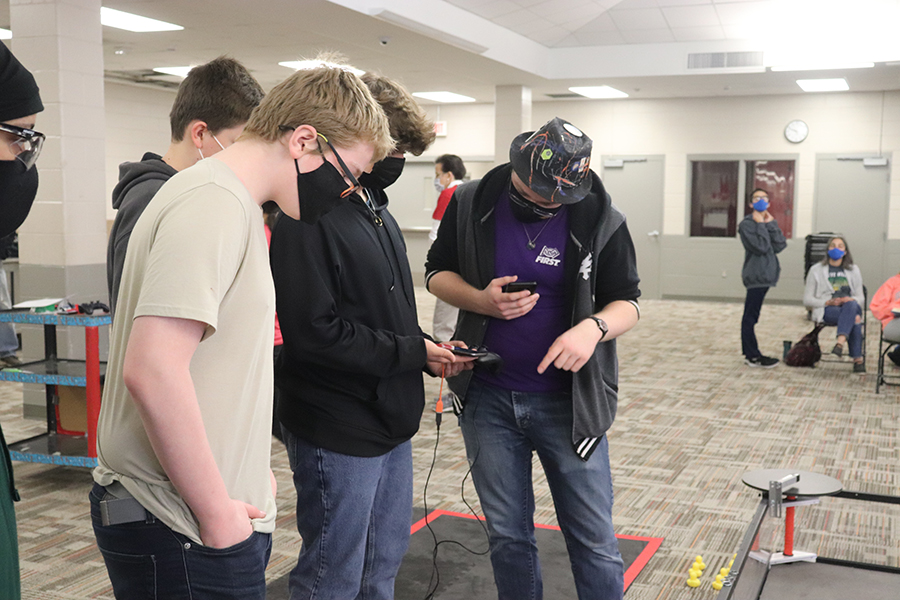 Haneen Eltyeb 25, AJ Kroemer 25, Grant Brownlee 25, Ian Wells 24 go through field inspection to ensure that the robot is safe and prepared to run on the field. (Left to Right) 