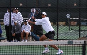 Luca Chackalackal 22 getting in position to hit the ball at the West High tennis courts on April 14th. 