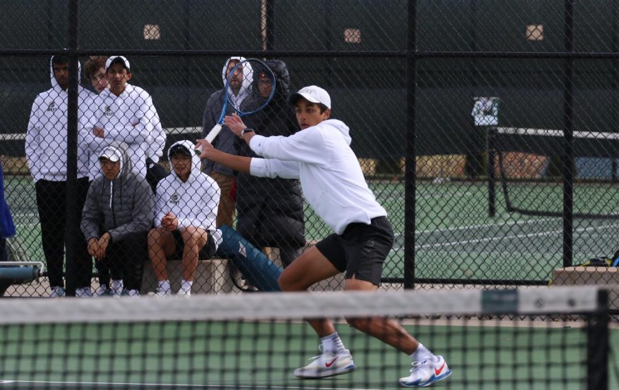 Luca Chackalackal 22 getting in position to hit the ball at the West High tennis courts on April 14th. 