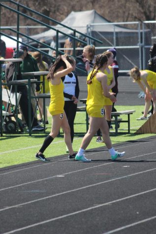 Leslie Kimura 24’ and Sara Alaya 22’ getting ready for their leg of the 4x8 at the Eastern Iowa Track & Field Festival