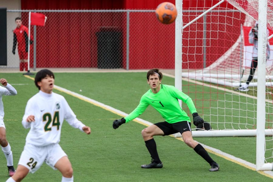 Nick McDonnell 22 eyes the ball as it crosses the box against City High on April 15.