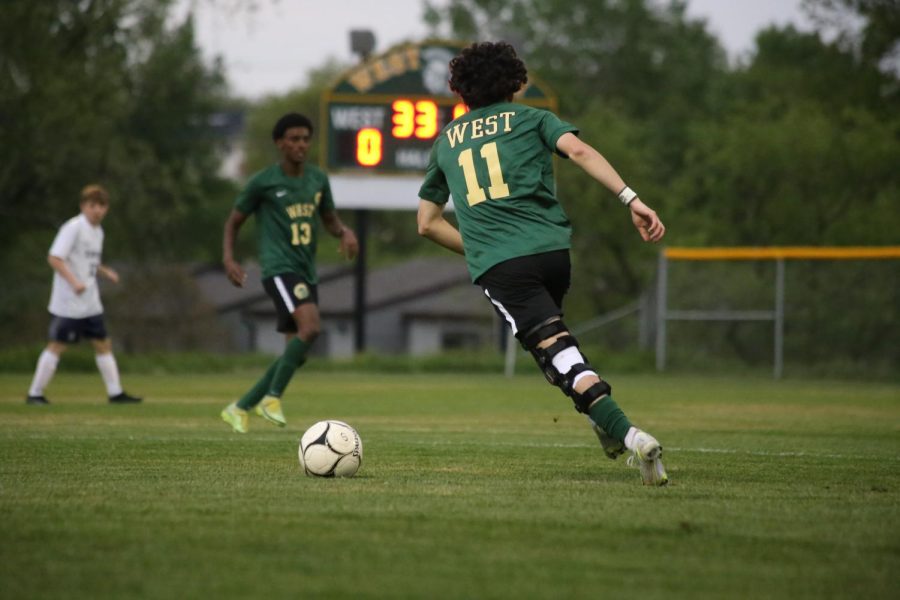 Chris Martinez 22 glides down the field on May 17.