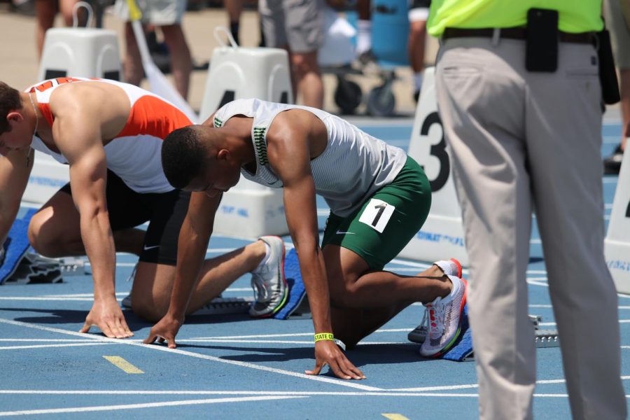 Barry Diallo 23 waits 
for the starters signal before the 100 meter sprint preliminary round.