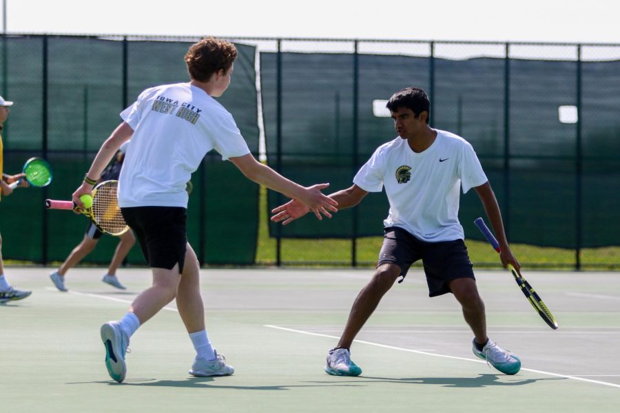 Patrick Selby 24 and Shivy Mannengi 23 pump each other up during the IHSAA District Tennis Tournament at West High on May 9.