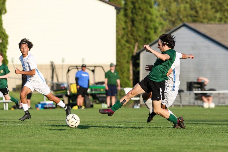Michael Nelson 23 takes a shot on goal against Jefferson on May 13.