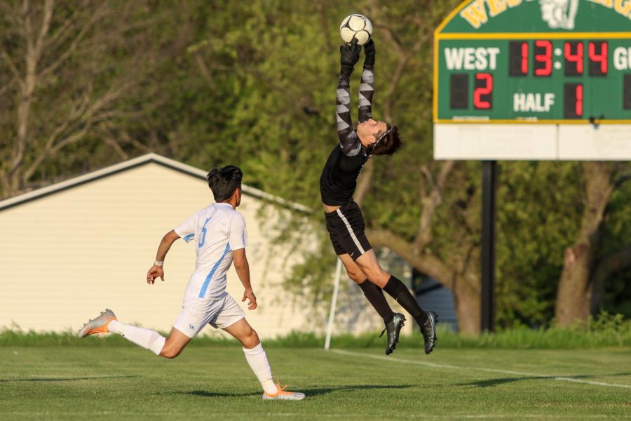 Nicholas McDonnell 22 leaps into the air to make a save against Jefferson on May 13.