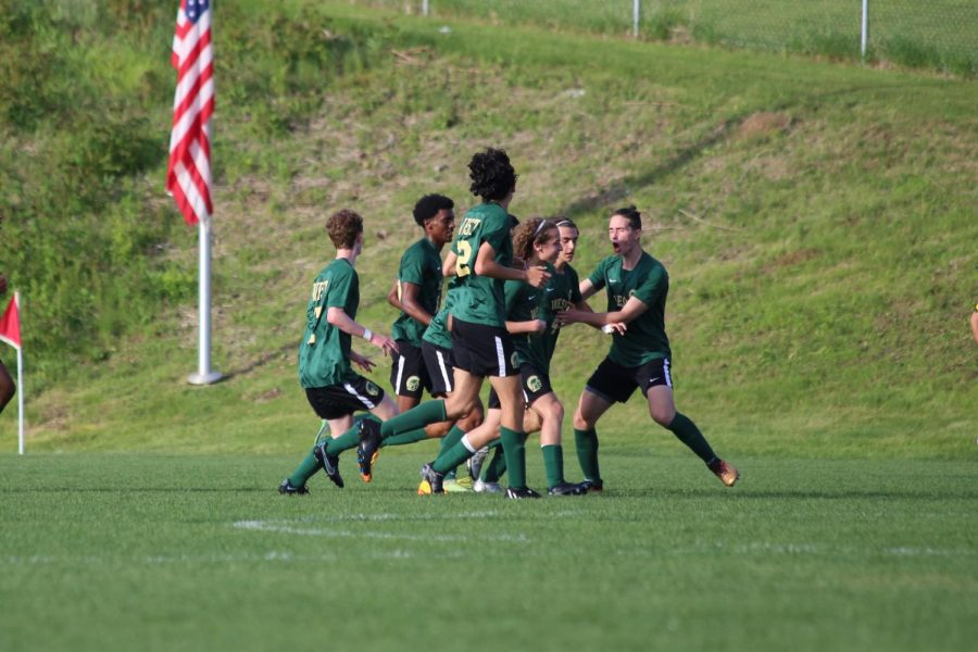 The team celebrates the first of senior Miguel Cohen Suarezs three goals at the substate final on May 25.