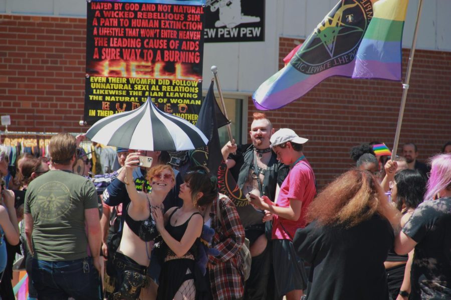 Participants disapprove of Anti-LGBTQ+ protesters during the Iowa City Pride Celebration June 18.